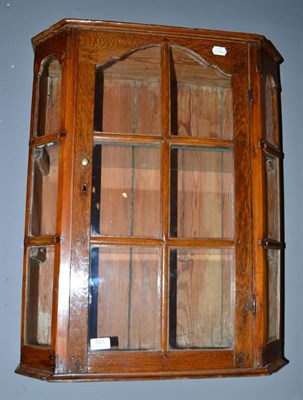 Lot 503 - Stained pine glazed hanging wall cabinet with glass shelves