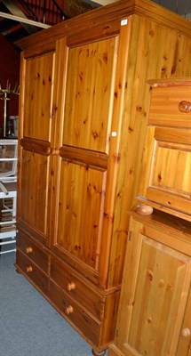 Lot 589 - A modern pine double wardrobe