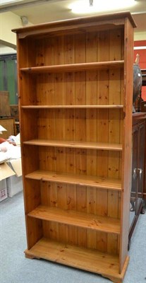 Lot 592 - A modern pine bookcase with five non-adjustable shelves