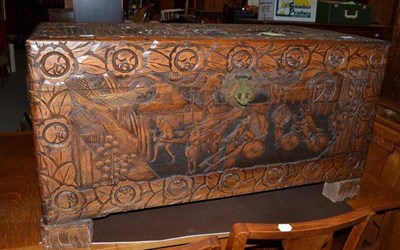 Lot 615 - A carved camphor wood chest