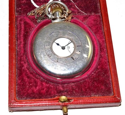 Lot 19 - A silver half hunter pocket watch, movement signed Rolex, with a watch chain, clasp stamped 9ct