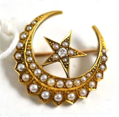 Lot 25 - A star and crescent brooch, circa 1880, the star sits within the curve of the crescent, the...