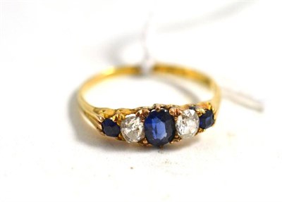 Lot 36 - An 18ct gold diamond and sapphire five stone ring