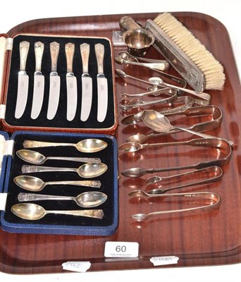 Lot 60 - Nine pairs of silver sugar tongs, a silver spoon, Chester silver pounce pot, silver medallion,...