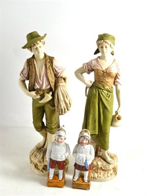 Lot 74 - Pair of Royal Dux Bohemian figures (a.f.) and a pair of figures made in Germany