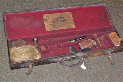 Lot 117 - A 19th century leather shotgun case with oil bottle, cleaning brush, snapcap etc, the cover set...