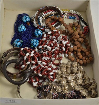 Lot 140 - A quantity of ethnic jewellery including Zulu beads and African manilla