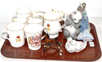 Lot 150 - Three Nao figures, eight Royal Commemorative cups, two Beswick foals and a basket