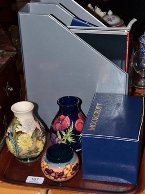 Lot 167 - Three modern Moorcroft vases, including 'Anemone Blue' and 'Trial' with auction catalogues etc