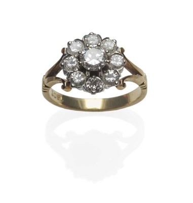 Lot 348 - A Diamond Cluster Ring, a round brilliant cut diamond within a border of eight smaller, in...