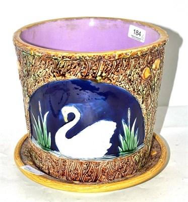 Lot 184 - Victorian majolica planter and stand moulded with swans in bullrushes