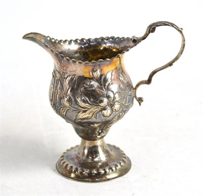 Lot 193 - George III silver cream jug, London 1777, with later repousse decoration