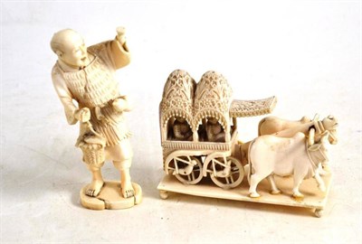 Lot 198 - Ivory oxen cart with figures and an ivory figure of a street vendor