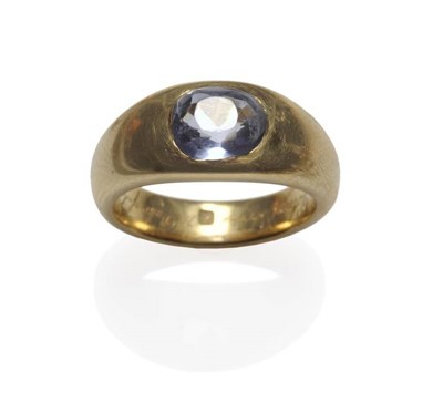 Lot 350 - A 19th Century Sapphire Ring, the cushion cut pale blue stone inset to a tapered yellow band,...