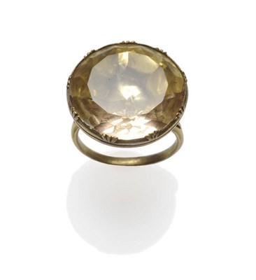 Lot 352 - A Citrine Ring, the round mixed cut citrine in a yellow claw fronted closed back setting, on a...