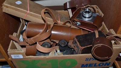 Lot 256 - A brass three drawer telescope, a pair of binoculars, a shoe stretcher, three camera and a tripod