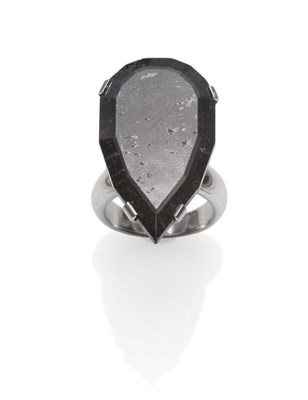 Lot 357 - An 18 Carat White Gold Black Diamond Solitaire Ring, the pear cut black diamond in a white claw...