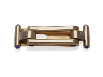 Lot 364 - A Tie Slide, by Cartier, of open centred oblong form, with bar terminals, set with a cabochon...