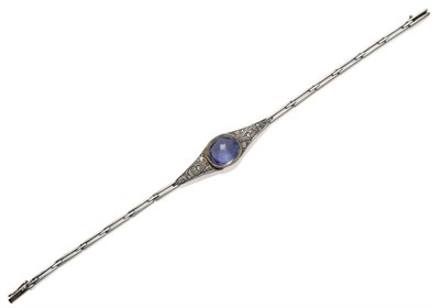 Lot 376 - A Russian Sapphire and Diamond Bracelet, a cabochon light blue sapphire in a yellow millegrain...