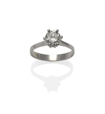 Lot 377 - A Diamond Solitaire Ring, the round brilliant cut diamond in a high white six claw setting, to...