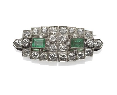 Lot 378 - An Emerald and Diamond Double Clip Brooch, circa 1920, each of the two geometric clips set with...