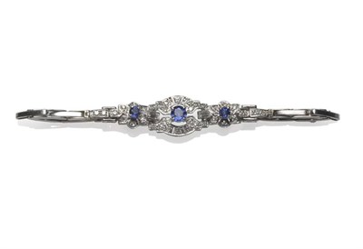 Lot 379 - A Sapphire and Diamond Bracelet, circa 1930, three round brilliant cut sapphires in white claw...