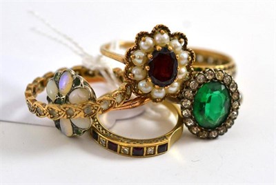 Lot 11 - A ruby and diamond half eternity ring, an opal cluster ring, a garnet and split pearl cluster...