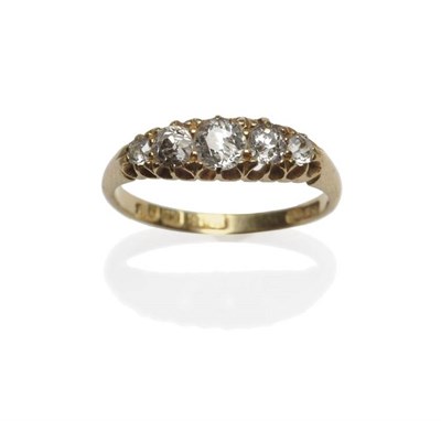 Lot 386 - An 18 Carat Gold Diamond Five Stone Ring, the graduated old cut diamonds in a yellow claw...