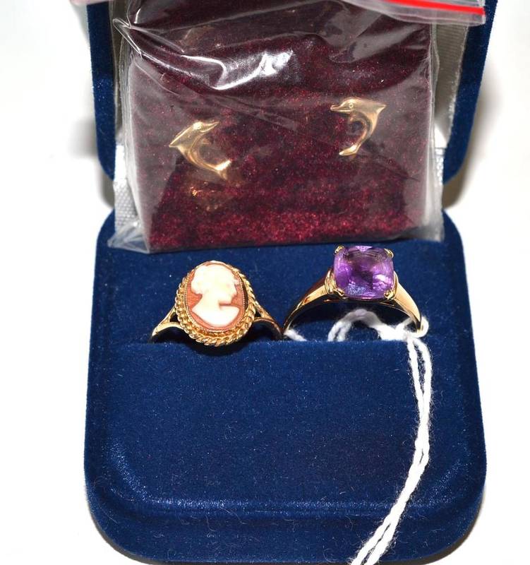 Lot 46 - A 9ct gold amethyst ring, a 9ct gold cameo ring and a pair of dolphin earrings