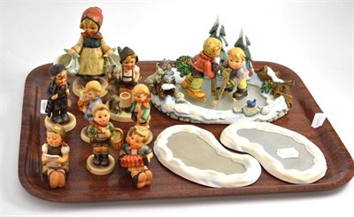 Lot 82 - Hummel ice skater group and eight other figures and two stands
