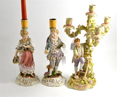 Lot 96 - A pair of Continental figural candlesticks and a Continental floral encrusted four branch...