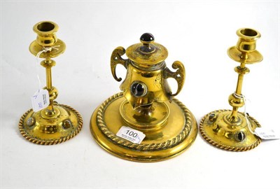 Lot 100 - A Victorian brass inkstand with tigers eye cabochon mounts, also a pair of matching candlesticks