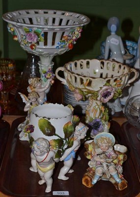 Lot 103 - Two Continental floral encrusted table centrepieces and two other Continental figural pieces