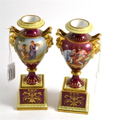 Lot 119 - A pair of ";Vienna"; porcelain urn shaped vases, circa 1900, decorated with ";Edward u.Eleanorai"