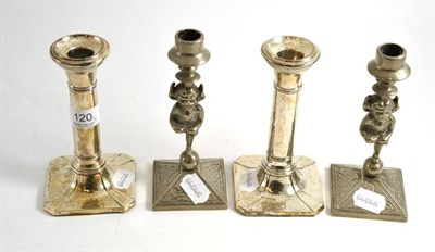 Lot 120 - A pair of silver candlesticks and a pair of Lincoln Imp candlesticks