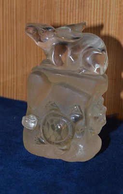 Lot 139 - A rock crystal carved with a rabbit, frog and turtle as one