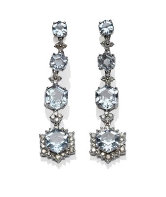 Lot 398 - A Pair of Blue Topaz and Diamond Drop Earrings, the graduated hexagonal shaped blue topaz spaced by