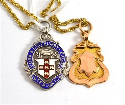 Lot 173 - A 9ct shield on a 9ct gold necklace and a silver enamelled shield for 'York and District Rugby...