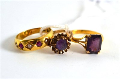 Lot 199 - An 18ct gold ring and three dress rings