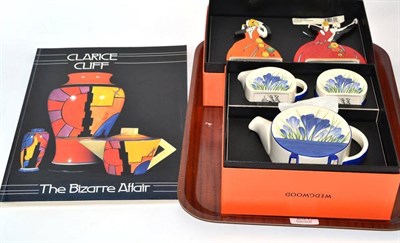 Lot 201 - A pair of Wedgwood Clarice Cliff figures, a similar three piece tea service and one volume '...