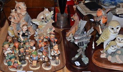 Lot 233 - A collection of fourteen Hummel figures including a chimney sweep and a skier, a Beswick bay...