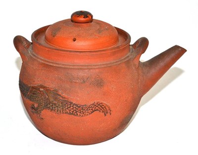 Lot 276 - A Chinese Yixing teapot and cover decorated with a dragon