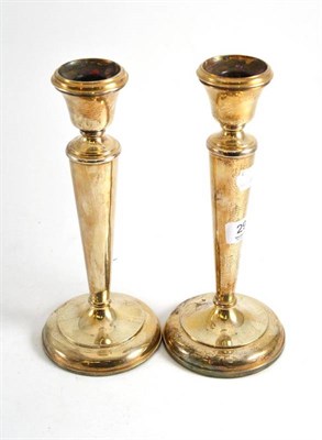 Lot 294 - A pair of silver candlesticks, Birmingham 1920 (loaded)