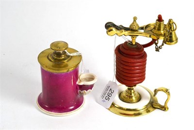 Lot 295 - Victorian brass and porcelain wax jack and a 19th century brass and English porcelain ink pump (2)