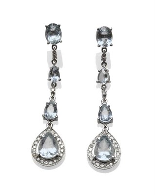 Lot 415 - A Pair of Aquamarine, Blue Topaz and Diamond Drop Earrings, an oval cut aquamarine stud...