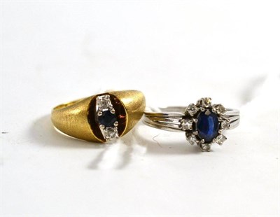 Lot 333 - A sapphire and diamond cluster ring and a sapphire and diamond three stone ring