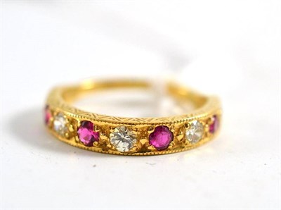 Lot 354 - 18ct gold ruby and diamond half eternity ring