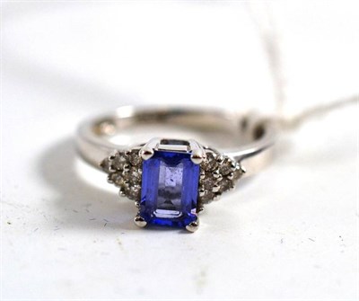 Lot 357 - A purple stone (possibly tanzanite) and diamond set ring, stamped '14K'