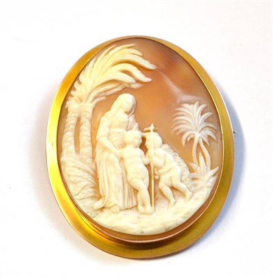 Lot 419 - A Cameo Brooch, the oval shell carved with a religious scene, in a plain polished mount,...