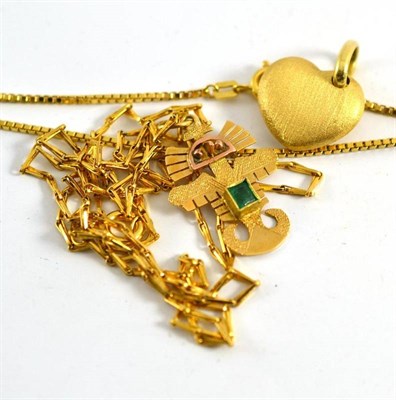 Lot 363 - A box link chain, a heart pendant and an emerald set pendant on chain